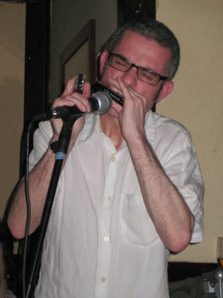 Rob playing the harmonica
